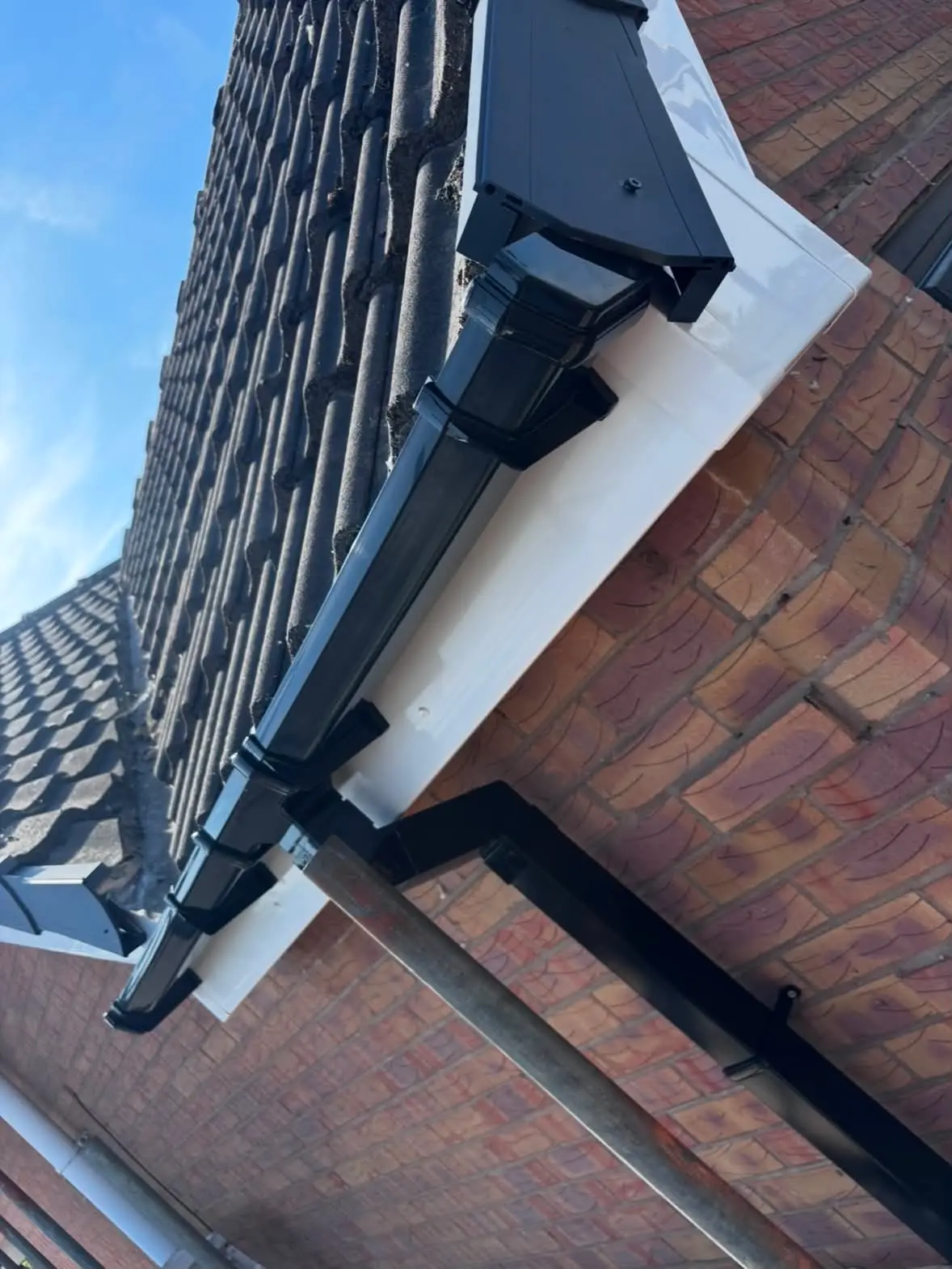 Completed guttering fascia and downpipe installation
