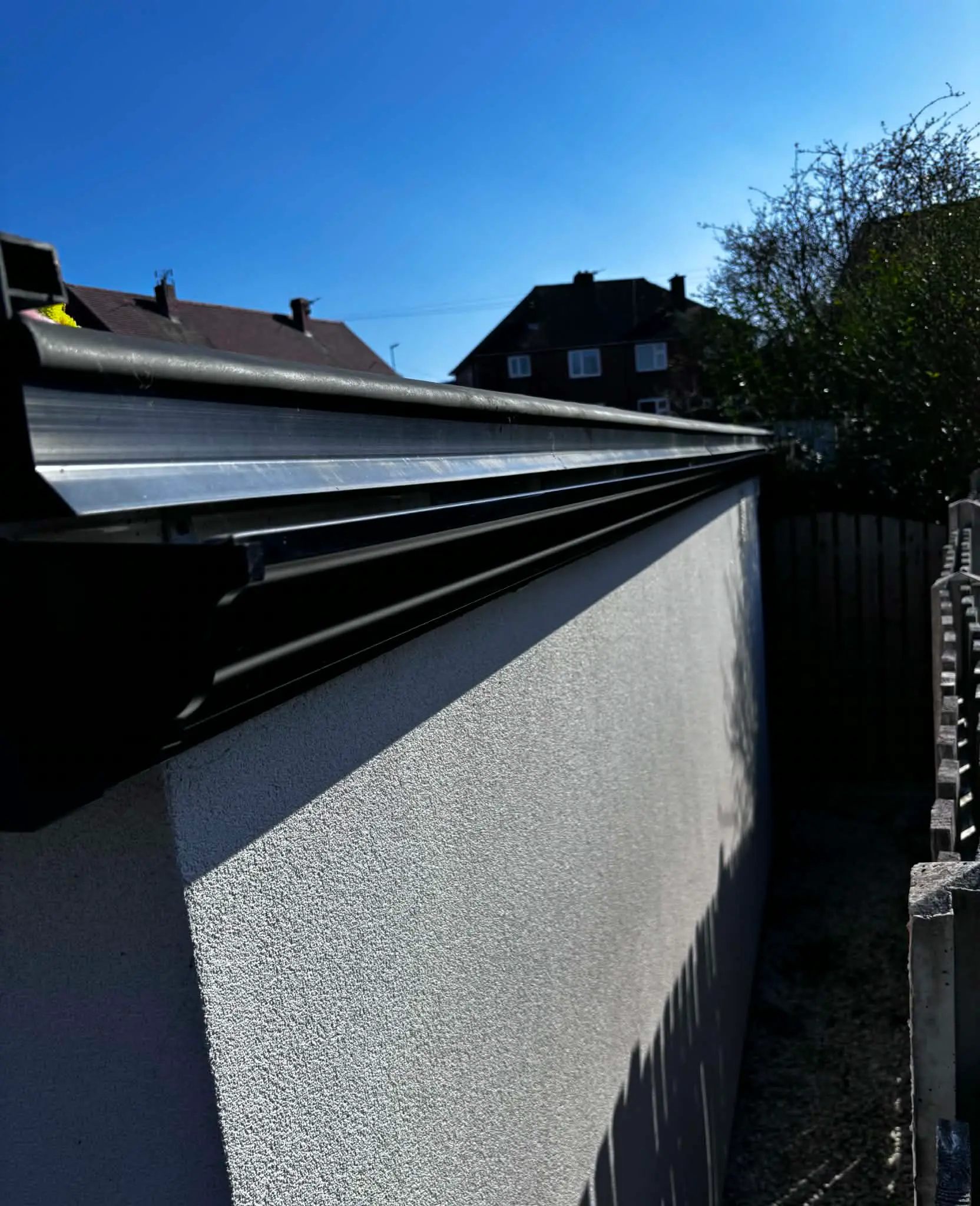 Aluminium guttering installed around roofline eaves